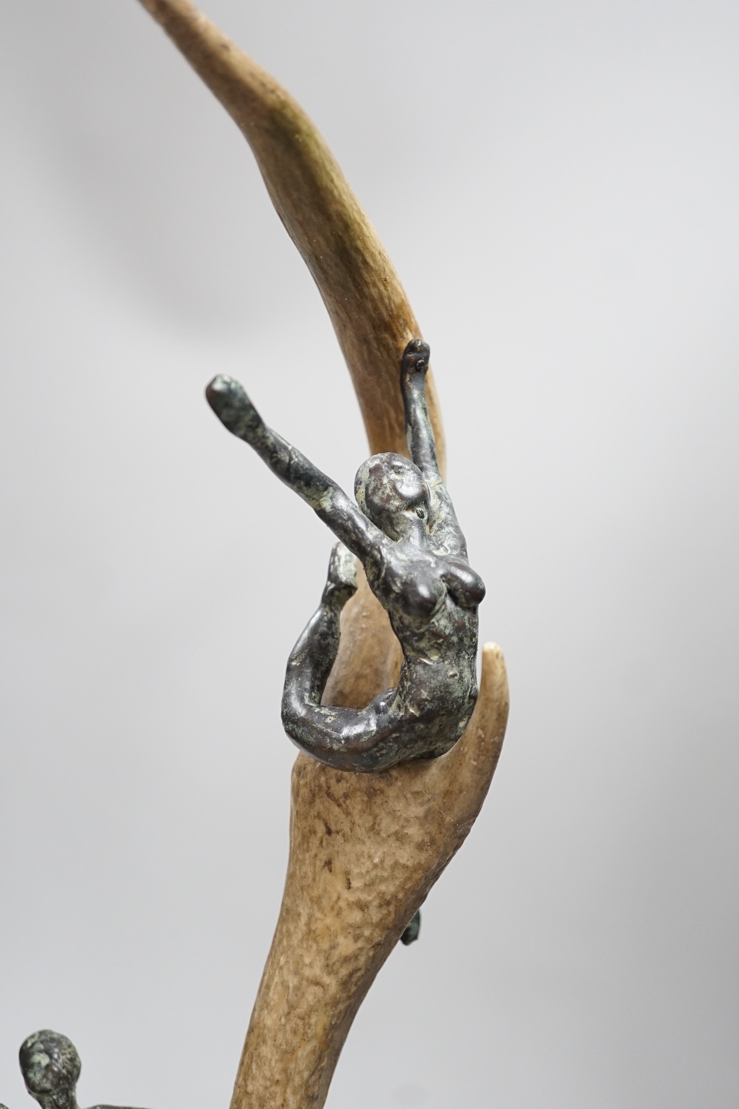 A pair of bronze and antler dancer groups in the style of Edgar Degas, 49cms high